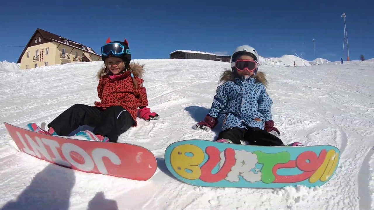 Kids on snowboards